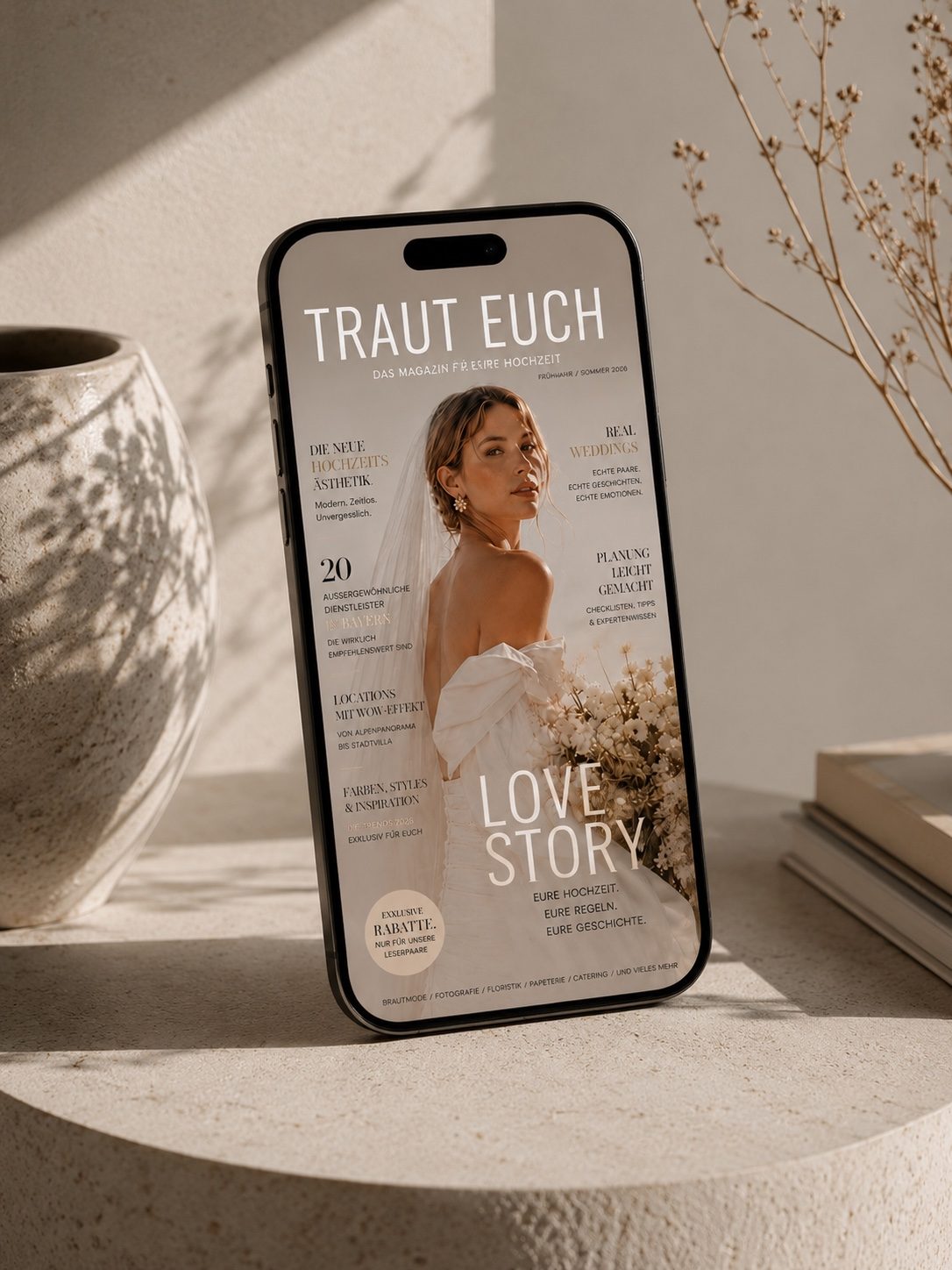 Smartphone mit dem digitalen Hochzeitsmagazin Traut Euch!